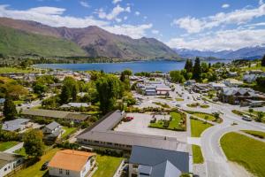 an aerial view of a small town next to a lake at Alpine Motel in Wanaka