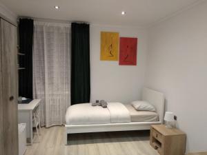 Posteľ alebo postele v izbe v ubytovaní Modern&Cozy Rooms