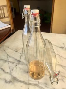 due bottiglie di vetro poste sopra un tavolo di provencal house with sunny terrace ad Aups