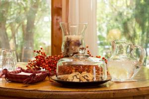 a table with a glass jar and a bowl of mushrooms at Sunflower Hill Inn in Moab