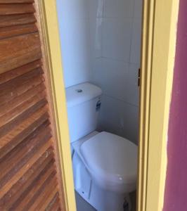 a bathroom with a toilet in a small room at Glamping Gypsy Hobart in Richmond