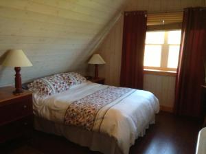 Postel nebo postele na pokoji v ubytování Gîte Au Coin De La Berge
