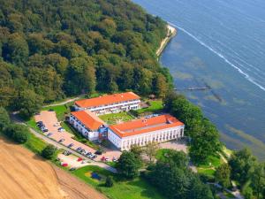 an aerial view of a building on an island in the water at Hotel Badehaus Goor in Putbus