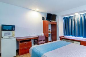 Cama o camas de una habitación en Americas Best Value Inn & Suites Brunswick