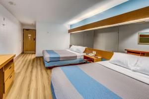 מיטה או מיטות בחדר ב-Motel 6-Sutherlin, OR