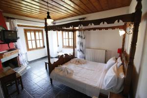 Posteľ alebo postele v izbe v ubytovaní Guesthouse Rousis
