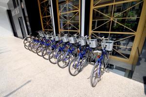 a row of bikes parked in front of a building at Kindness Hotel-Qixian in Kaohsiung