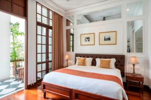 Postel nebo postele na pokoji v ubytování The Colony Hotel Bali