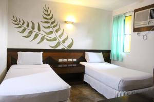 Afbeelding uit fotogalerij van Country Village Hotel in Cagayan de Oro