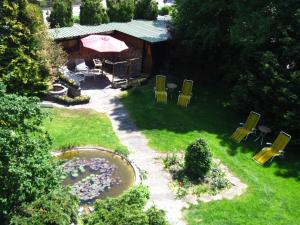 an overhead view of a backyard with chairs and an umbrella at Hotel Schick in Bad Wörishofen