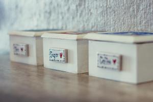 three boxes with writing on them sitting on the floor at True North West Coast in St Helena Bay