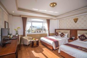Postel nebo postele na pokoji v ubytování Roy Dala Hotel + 37 fotografií