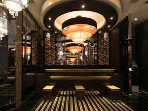 a lobby of a hotel with a chandelier at APA Hotel Kyoto Ekikita in Kyoto