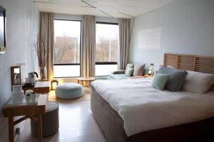 Ένα ή περισσότερα κρεβάτια σε δωμάτιο στο Skotel Amsterdam, Hotelschool The Hague