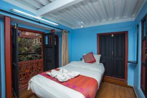 Postel nebo postele na pokoji v ubytování Kathmandu Boutique Hotel + 37 fotografií