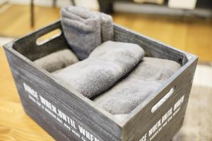 a wooden crate with a gray chair in it at Naha Southerlies Condominium Kumoji in Makishimachi