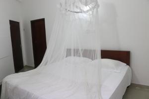 Postel nebo postele na pokoji v ubytování A.V.N HOMESTAY