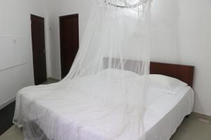 Postel nebo postele na pokoji v ubytování A.V.N HOMESTAY
