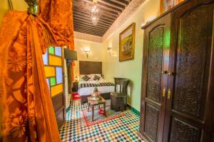Postel nebo postele na pokoji v ubytování Riad Ghita Palace
