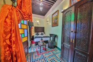 Postel nebo postele na pokoji v ubytování Riad Ghita Palace