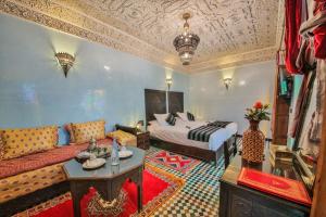 Postel nebo postele na pokoji v ubytování Riad Ghita Palace