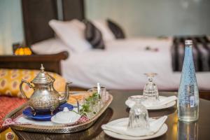 Postel nebo postele na pokoji v ubytování Riad Ghita Palace
