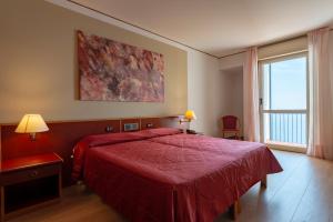 Postel nebo postele na pokoji v ubytování Hotel Torre Normanna