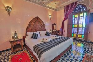 Postel nebo postele na pokoji v ubytování Riad Ghita Palace