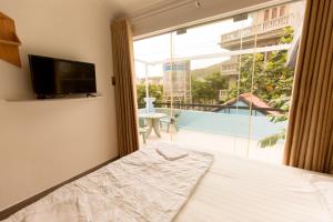 En eller flere senge i et værelse på Thuan Hoa Hotel