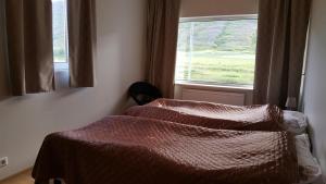 En eller flere senger på et rom på Kidagil Guesthouse