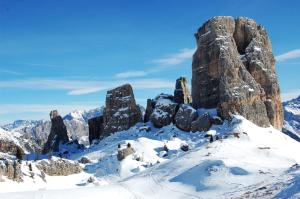 a rock formation in the snow on a mountain at Chalet alla Cascata in Badia +128 photos