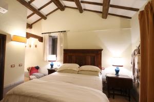 A bed or beds in a room at Casa Minotti Relais