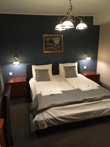Rúm í herbergi á Guest House Prenoćište Piccolina