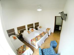 Кровать или кровати в номере Hotel Vitoria Marchi