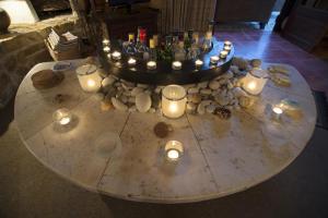 a table with candles and bottles and glasses on it at Tritonia in Gaios +10 photos