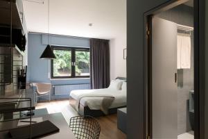 Cama o camas de una habitación en Hostellerie du Grünewald
