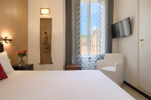 A bed or beds in a room at Alloggio per uso turistico D'Ambrosio Antonella Gli Scipioni 53