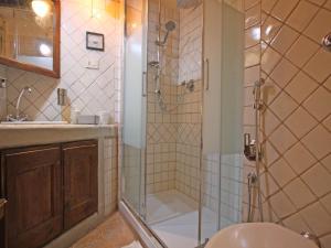a bathroom with a shower and a toilet and a sink at Terrace Apartment - Heart of Trastevere in Rome