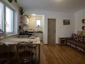 a living room with a couch and a table at Guest House Privát Štrba in Štrba