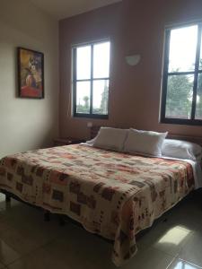 Postel nebo postele na pokoji v ubytování Hotel Posada San Antonio Coatepec