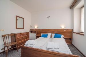 Postel nebo postele na pokoji v ubytování Locanda ai Dogi
