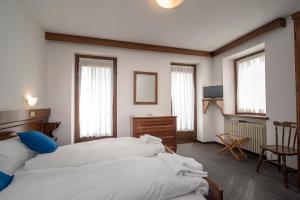 Postel nebo postele na pokoji v ubytování Locanda ai Dogi