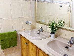 a bathroom with two sinks and a mirror at Apartamento ARENA en Santa Cruz de la Palma in Santa Cruz de la Palma +32 photos