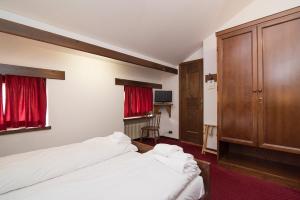 Postel nebo postele na pokoji v ubytování Locanda ai Dogi