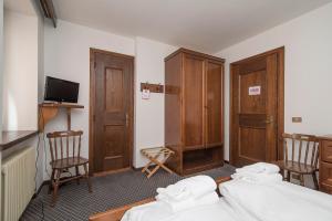 Postel nebo postele na pokoji v ubytování Locanda ai Dogi