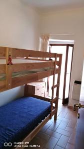 a bedroom with two bunk beds in a room at Le meridiane in Piè la Costa