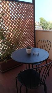 a blue table and two chairs on a patio at B&B Alcione in Pescara