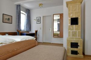 Postel nebo postele na pokoji v ubytování Hotel Bezold