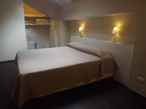 A bed or beds in a room at Hotel Bersè