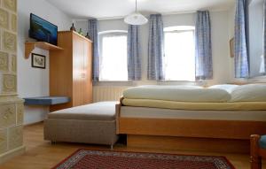 Postel nebo postele na pokoji v ubytování Hotel Bezold